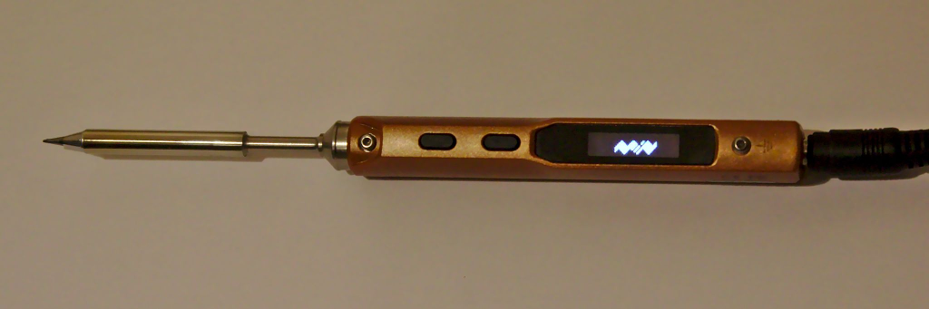 The TS100 soldering iron with original logo